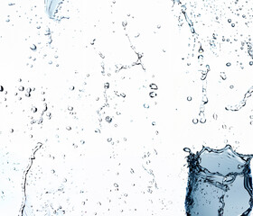 High-speed water droplets suspended in mid-air on a white background, freeze-frame capture.