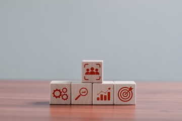Customer relationship management concept, Wooden blocks with business target icon for ecommerce...