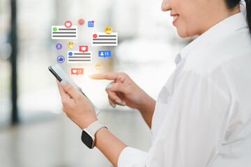 Engaged in social media, woman interacts with her smartphone, surrounded by various notification...