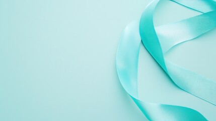 Naklejka premium Turquoise Ribbon on Light Blue Background