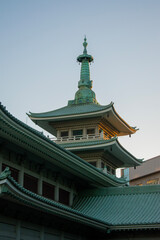Roof of Japanese temple against sky