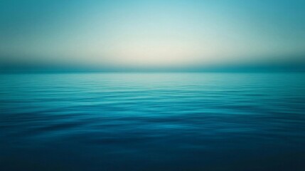 Calm Ocean Surface with a Hazy Sky in the Distance