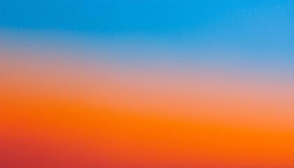 Obraz premium Fiery Sunset Hues: A breathtaking gradient of orange and blue paints the sky, a vibrant masterpiece of nature's artistry.