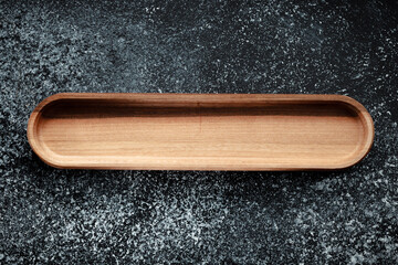 The sideboard is made of wood for serving snacks, fruits, nuts, cheeses, meats and original serving of main dishes. Luxury products from hard and exotic wood species. Accessories for a modern kitchen.