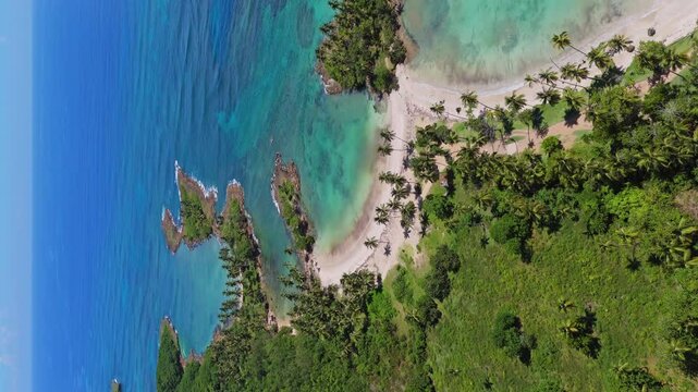 Playa Los Coquitos beach and coast, Cabrera in Dominican Republic. Aerial drone and vertical format