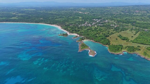 Playa Los Coquitos beach and surrounding landscape, Cabrera in Dominican Republic. Aerial drone panoramic view