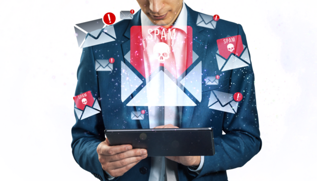 Businessman using a tablet surrounded by spam emails icons