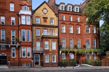 Elegant colorful old townhouses and apartment buildings in Chelsea district of London, facing the Thames