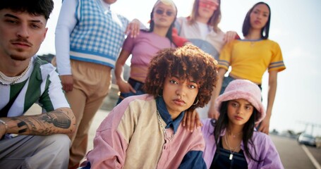 Confident, parking lot and portrait of friends in city with cool style, trendy fashion and cool outfit. Attitude, gen z and men and women in town for vacation, social gathering and holiday on weekend