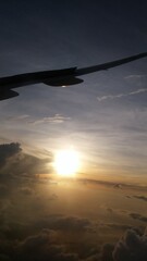 Airplane in the sky at sunset