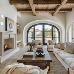 Modern living room with Mediterranean cottage style: rustic coffee table between sofa and chairs, fireplace, and arched windows create a cozy ambiance.