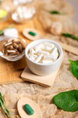 Homeopathy pills in a small ceramic bowl in a beautiful composition. Homeopathic medicine. Alternative medicines.