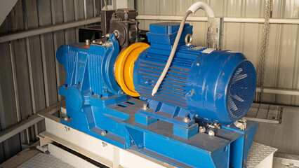 Industrial Electric Motor. Close-up of an industrial electric motor in a factory setting. 