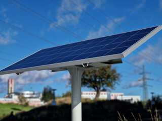 black solar panel by the river embankment. used to charge a parking meter, information interactive...