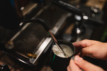 In charming cafes, the machine hissed as it steamed milk for a frothy cappuccino, the barista pouring it carefully into a cup, creating the perfect hot drink experience.