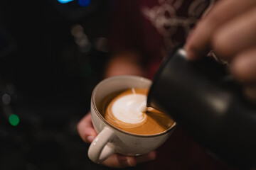 In bustling cafes, the barista crafted a hot drink, blending rich espresso and steamed milk into a latte adorned with intricate art, making each sip a delightful experience.