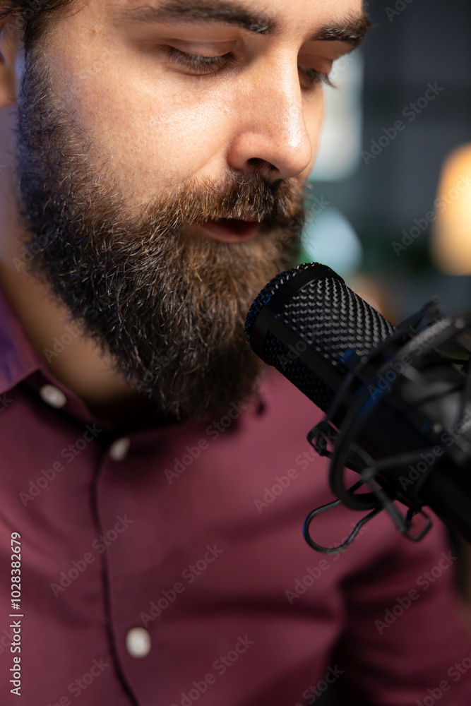 Poster close up of content creator using high tech quality mic in studio to do asmr video, discussing with 