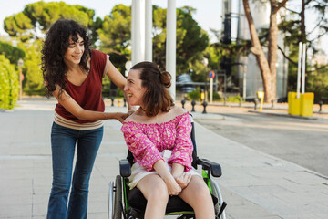 Nurse taking care of woman with physical disability