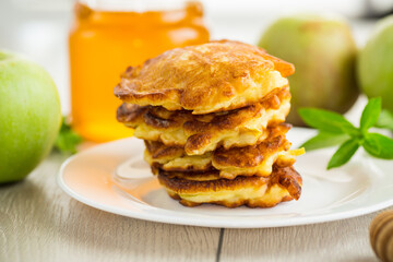 fried pancakes with apples and honey