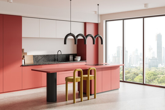 Modern kitchen with red cabinetry, acountertop, yellow stools, and distinctive pendant lights. Bright cityscape through large windows. 3D Rendering