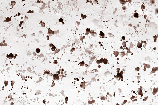 Abstract patterns of paints, on a white sheet of paper, in the artist's studio. Beautiful background for your creative design or illustrations.