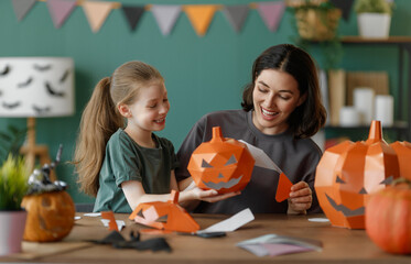 Happy family preparing for Halloween.