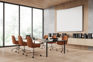 Conference room interior with furniture and projection screen, panoramic window