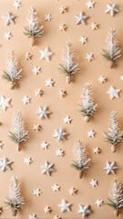 Miniature snowy Christmas trees and star decorations on beige background