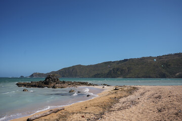 Fototapeta premium Kite Surfers and Island Peninsular - Lombok, Indonesia 