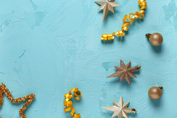 Composition with Christmas decor on turquoise background