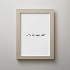 Minimalist "Happy Anniversary" text in a simple white frame on a neutral background
