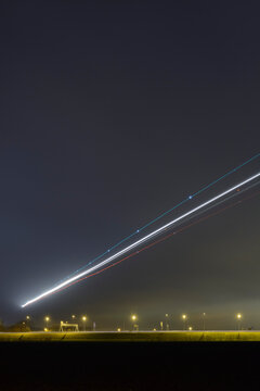Airplanes approaching at Amsterdam Schiphol airport under sky in Netherlands
