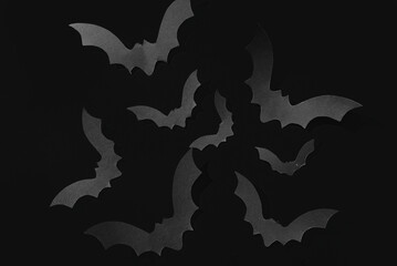 Paper bats for Halloween party on dark background