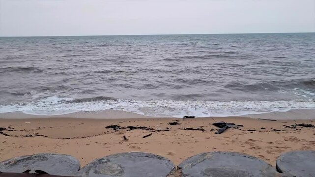 Natural Scenery Of The Batu Rakit Beach, Tanjung Kalian, Indonesia, With Small Waves Crashing In The Afternoon