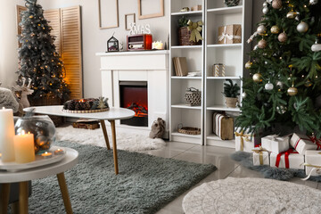 Interior of festive living room with Christmas tree, presents and fireplace