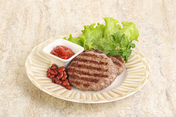 Grilled beef burger cutlet with sauce