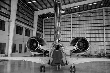 Private Airplane Engine Jet on The wing During Repair in The Hangar.
