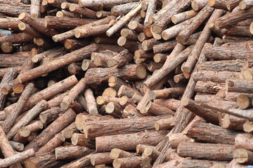 stack of wood logs to be used as firewood. pile of firewood for sale