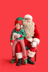 Santa Claus and cute little elf on red background