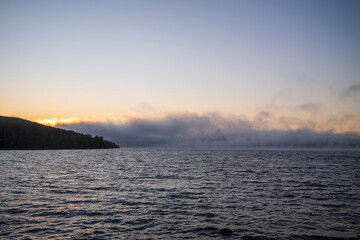sunrise with fog over the lake