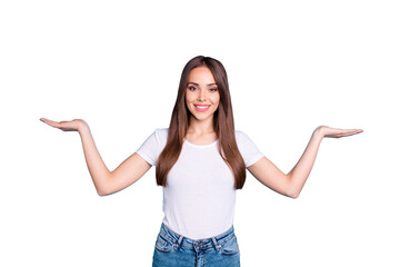Portrait of confident lady advertising promotion wearing white t-shirt denim jeans isolated over...