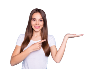 Portrait of lovely millennial holding hand pointing to ads with her index finger isolated over blue background