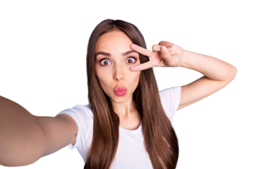 Close up photo of playful teen making photos v-signs wearing white t-shirt isolated over blue background