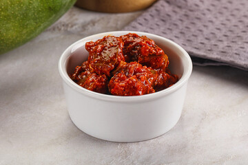 Spicy pickled raw green mango