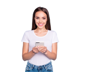 Portrait of lovely girl holding device looking at camera wearing white t-shirt denim isolated over blue background