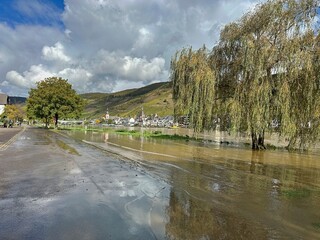 A road flooded by high water in the Moselle, with sludge from the river.