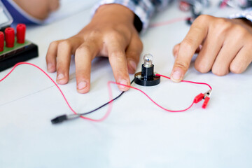 The study electrical circuit systems of students by experimenting with electrical connections using...