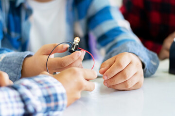 The study electrical circuit systems of students by experimenting with electrical connections using...