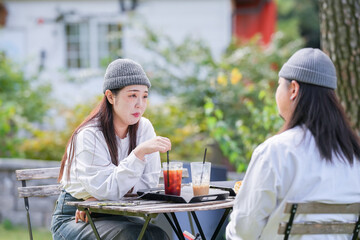 A Korean man and a Japanese woman, both in their 30s and a married couple, are enjoying an autumn...