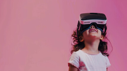 Fototapeta premium young girl joyfully experiences virtual reality with headset against vibrant pink background, showcasing her excitement and curiosity